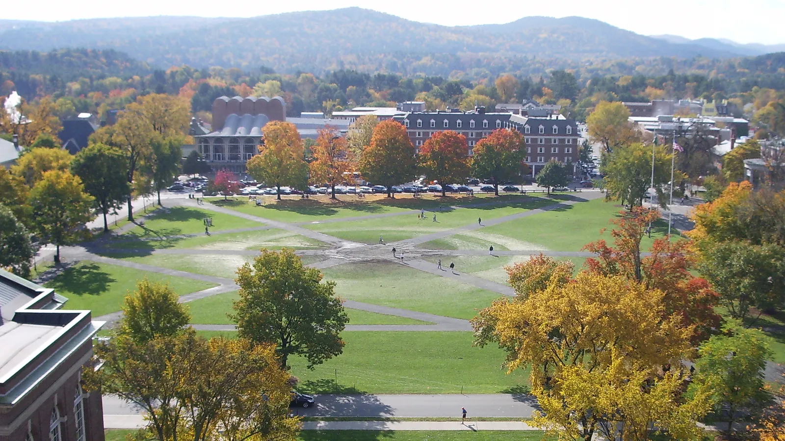 An aerial view of the Dartmouth Green surrounded by fall foliage in Hanover, New Hampshire
