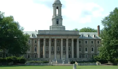 Old Main, Penn State's iconic administration building, on a summer day