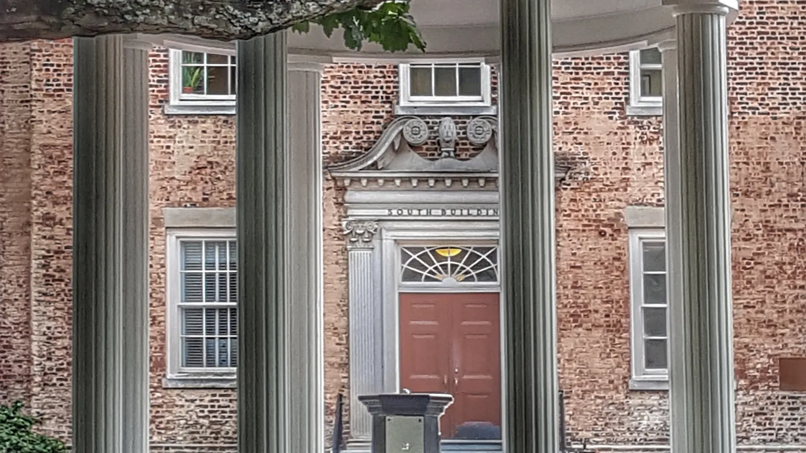 The Old Well framing the entrance to South Building on UNC-Chapel Hill's campus