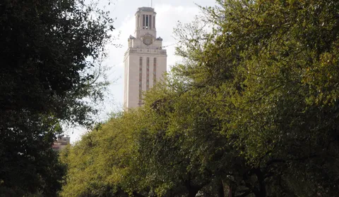 The University of Texas Tower viewed from the east, framed by campus trees