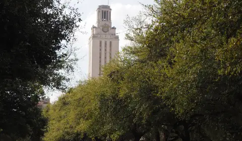 The University of Texas Tower viewed from the east, framed by campus trees